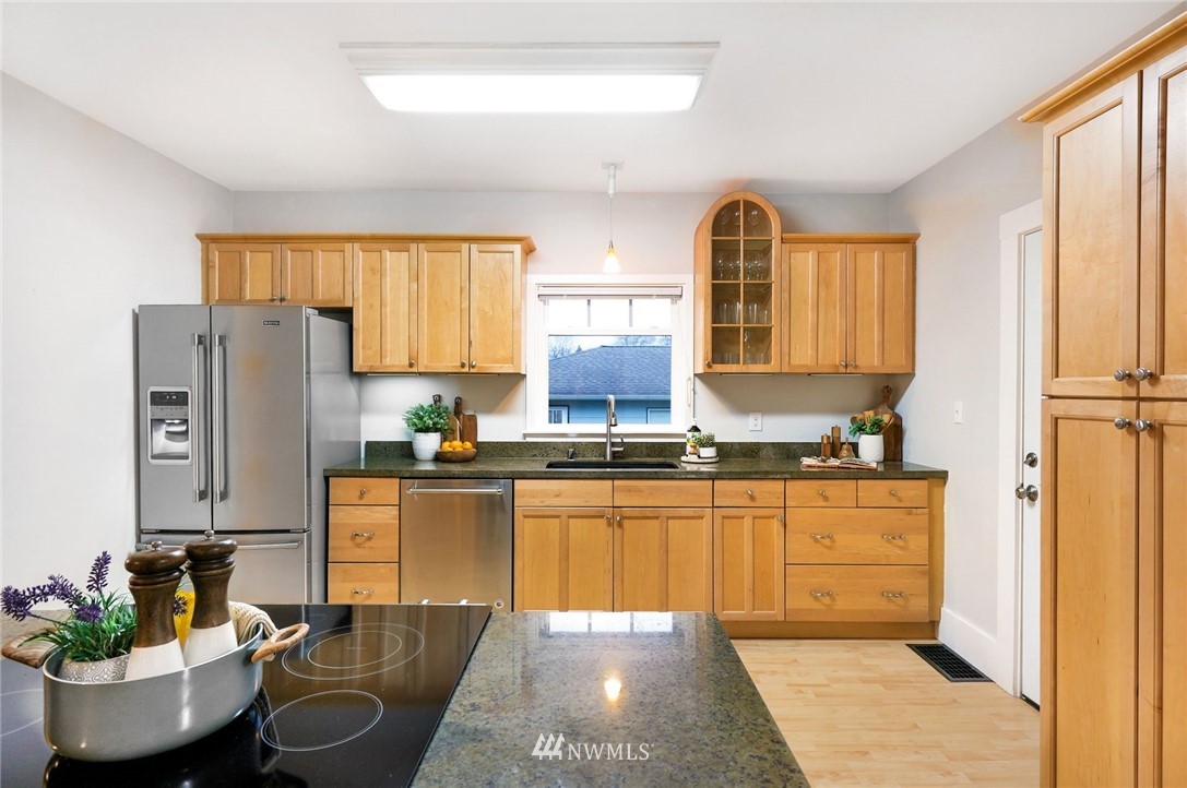 1509 Rucker Avenue Everett, WA 98201 - Photo 10 of 39 a kitchen with stainless steel appliances granite countertop a stove refrigerator and sink