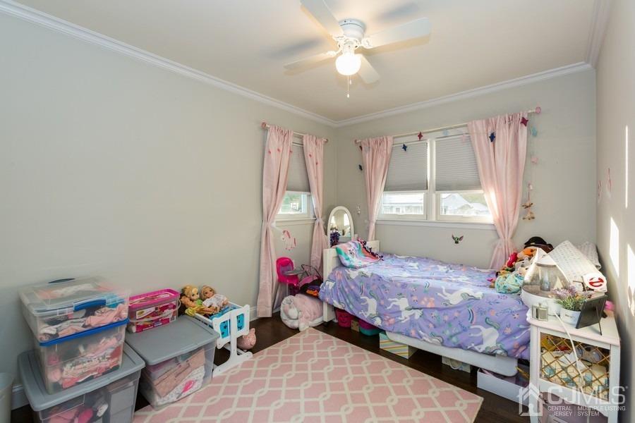 10 Yale Road Old Bridge, NJ 08859 - Photo 14 of 16 a bedroom with a bed and a chandelier
