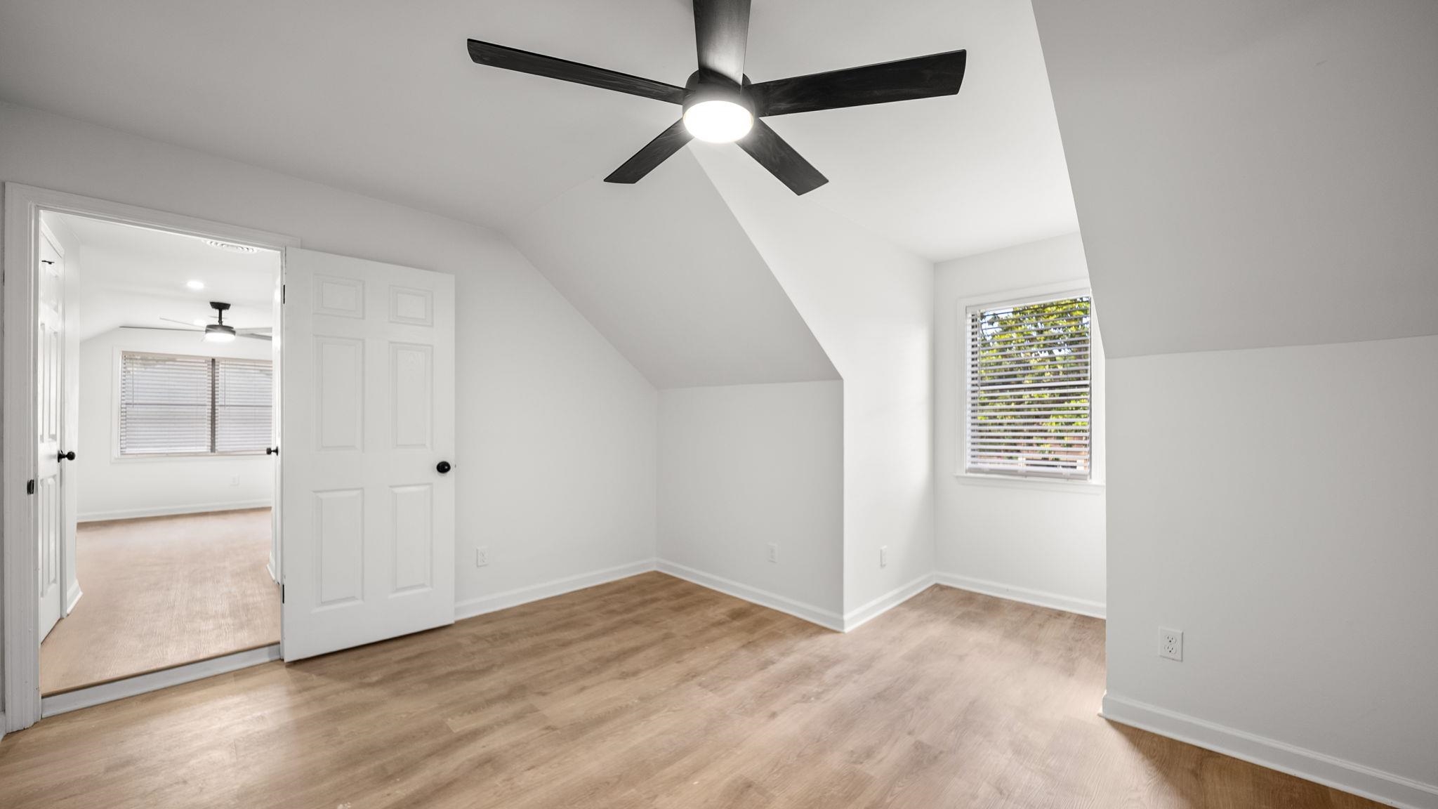 4351 Spring Oak Cove Memphis, TN 38125 - Photo 33 of 40 wooden floor in an empty room with a window