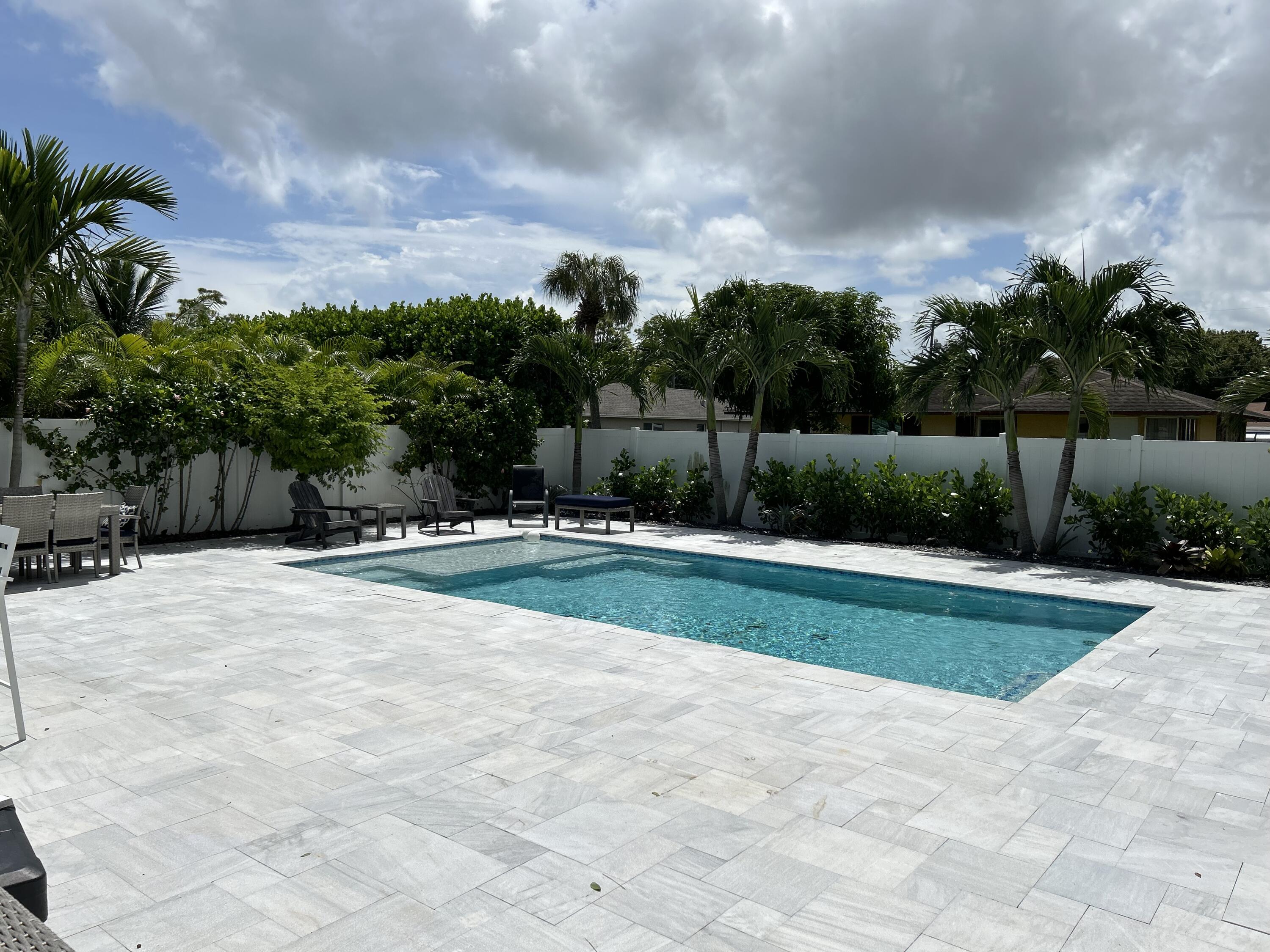 6882 3rd Street Limestone Creek, FL 33458 - Photo 16 of 17 a view of outdoor space yard and swimming pool