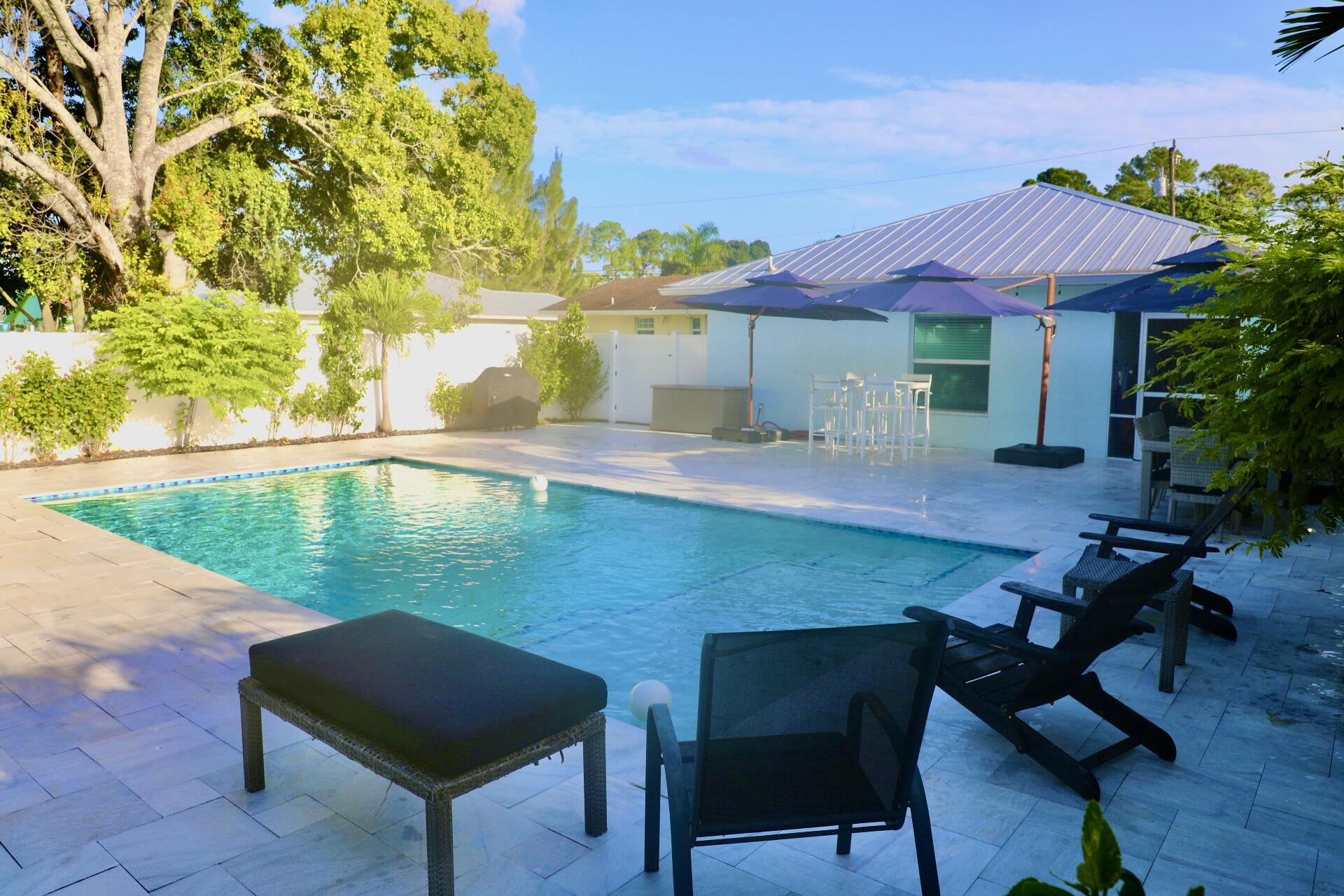 6882 3rd Street Limestone Creek, FL 33458 - Photo 17 of 17 a view of a chairs and table in the patio