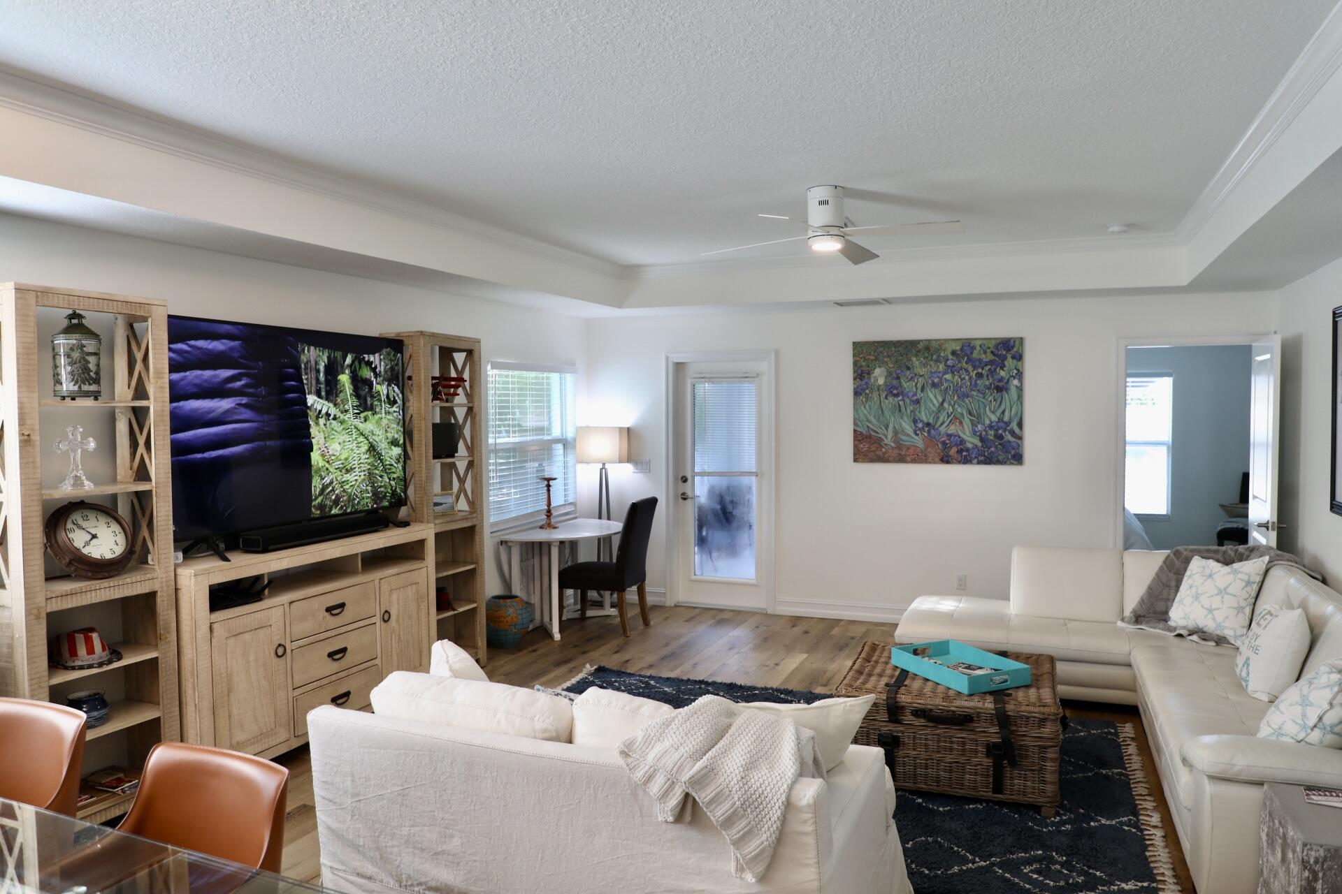 6882 3rd Street Limestone Creek, FL 33458 - Photo 5 of 17 a living room with furniture and a flat screen tv