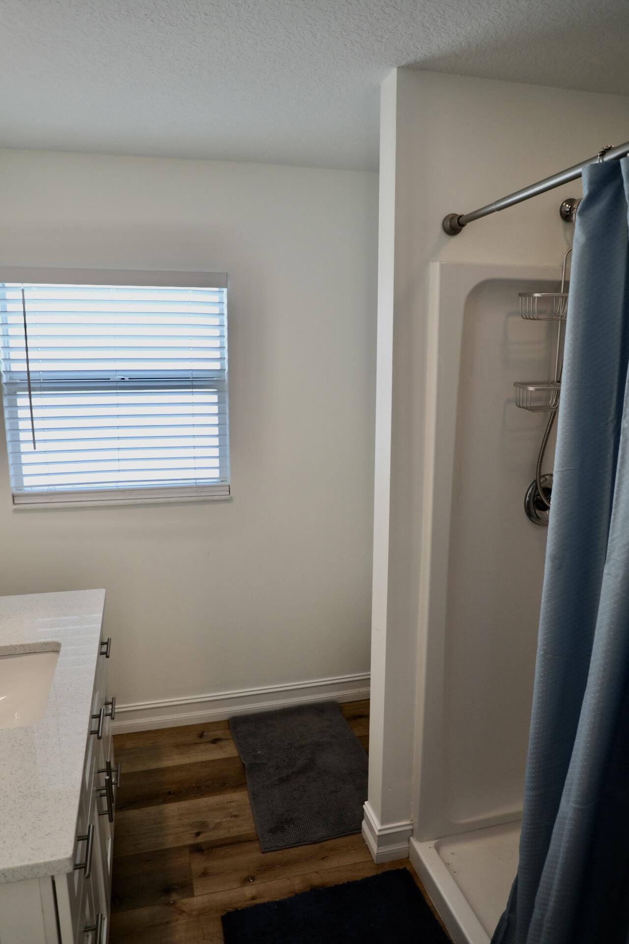 6882 3rd Street Limestone Creek, FL 33458 - Photo 10 of 17 a bathroom with a bathtub