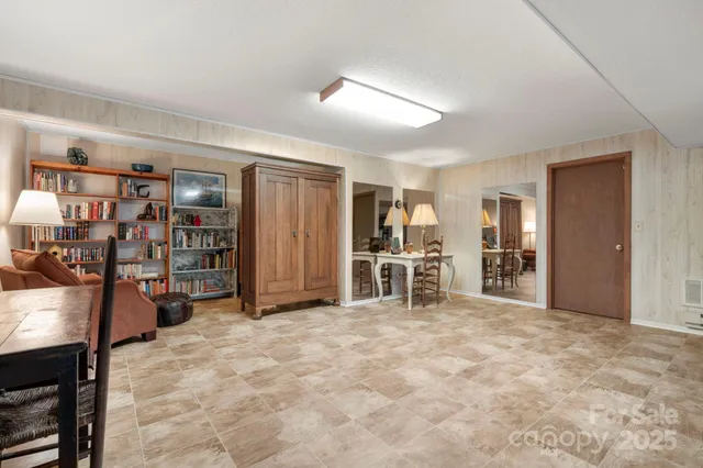 a bedroom with furniture and a window