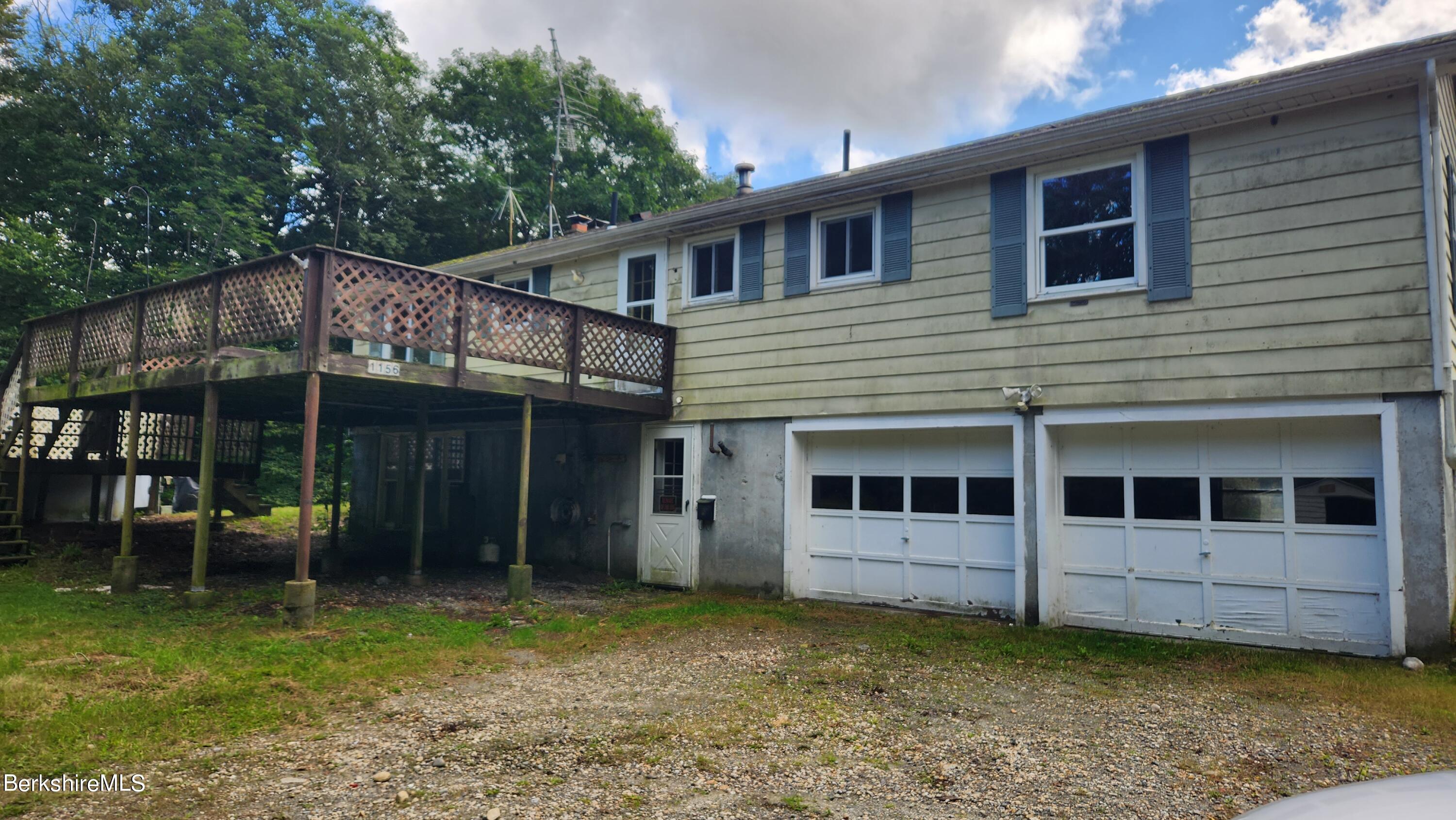 1156 Monterey Road Otis, MA 01253 - Photo 3 of 11 a view of a house with a garden