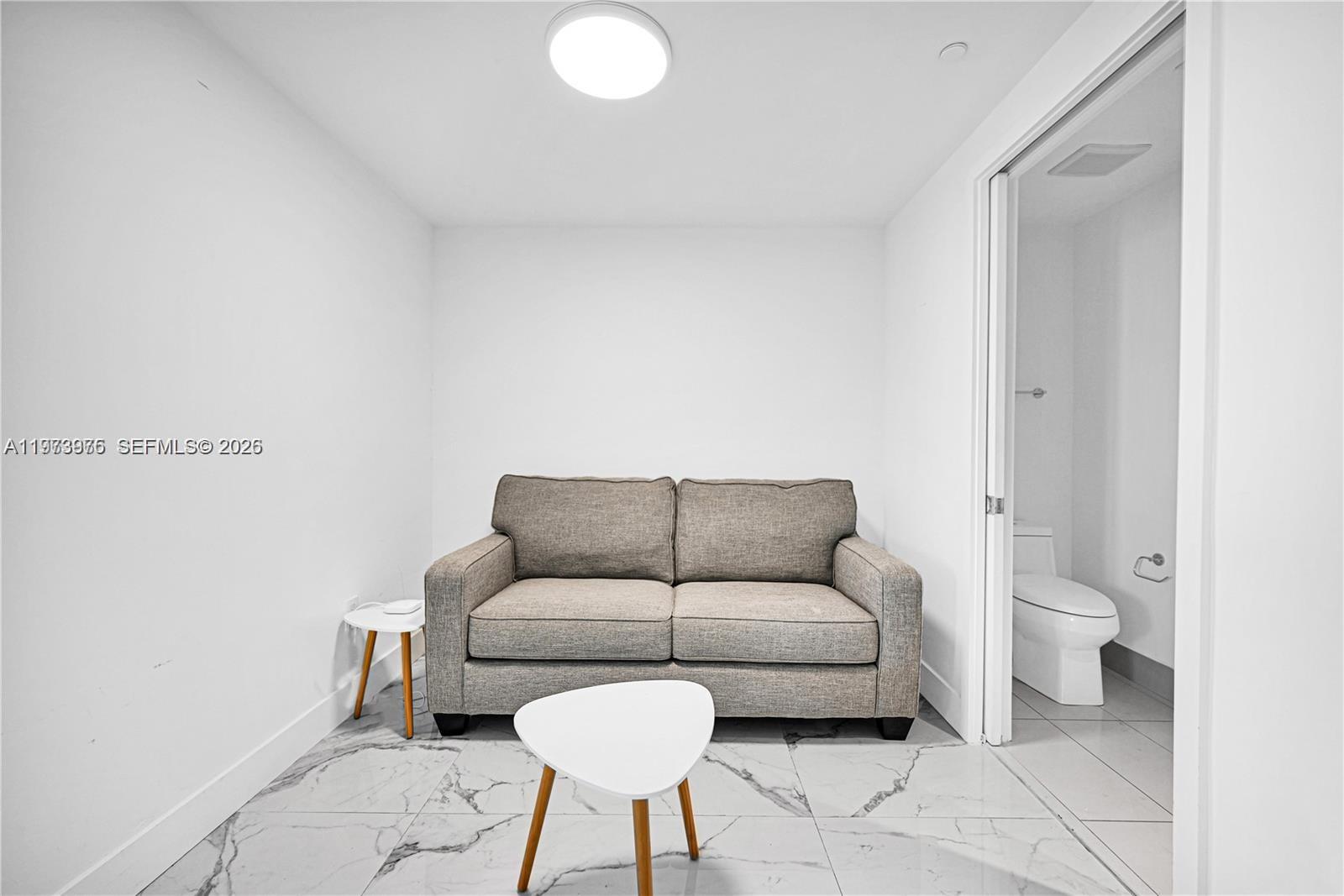 650 Northeast 32nd Street, Unit 2007 Miami, FL 33137 - Photo 17 of 44 a living room with furniture and a couch