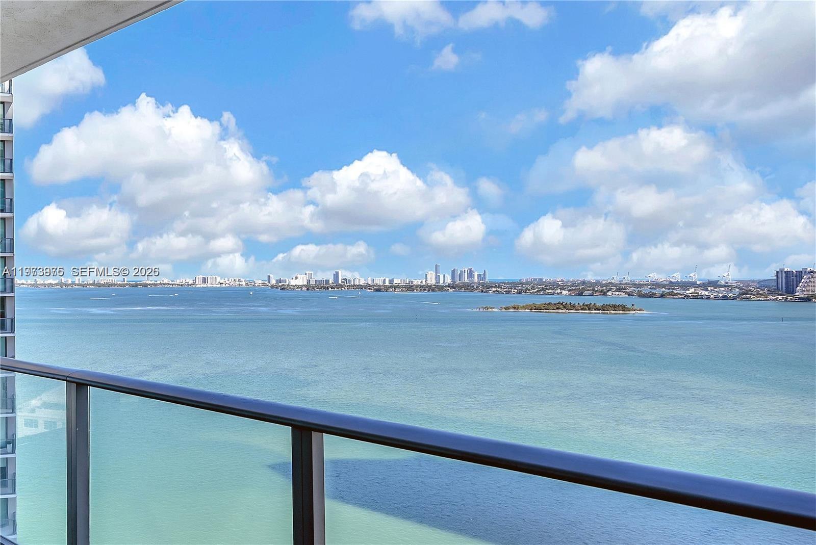 650 Northeast 32nd Street, Unit 2007 Miami, FL 33137 - Photo 23 of 44 a view of a lake from a balcony