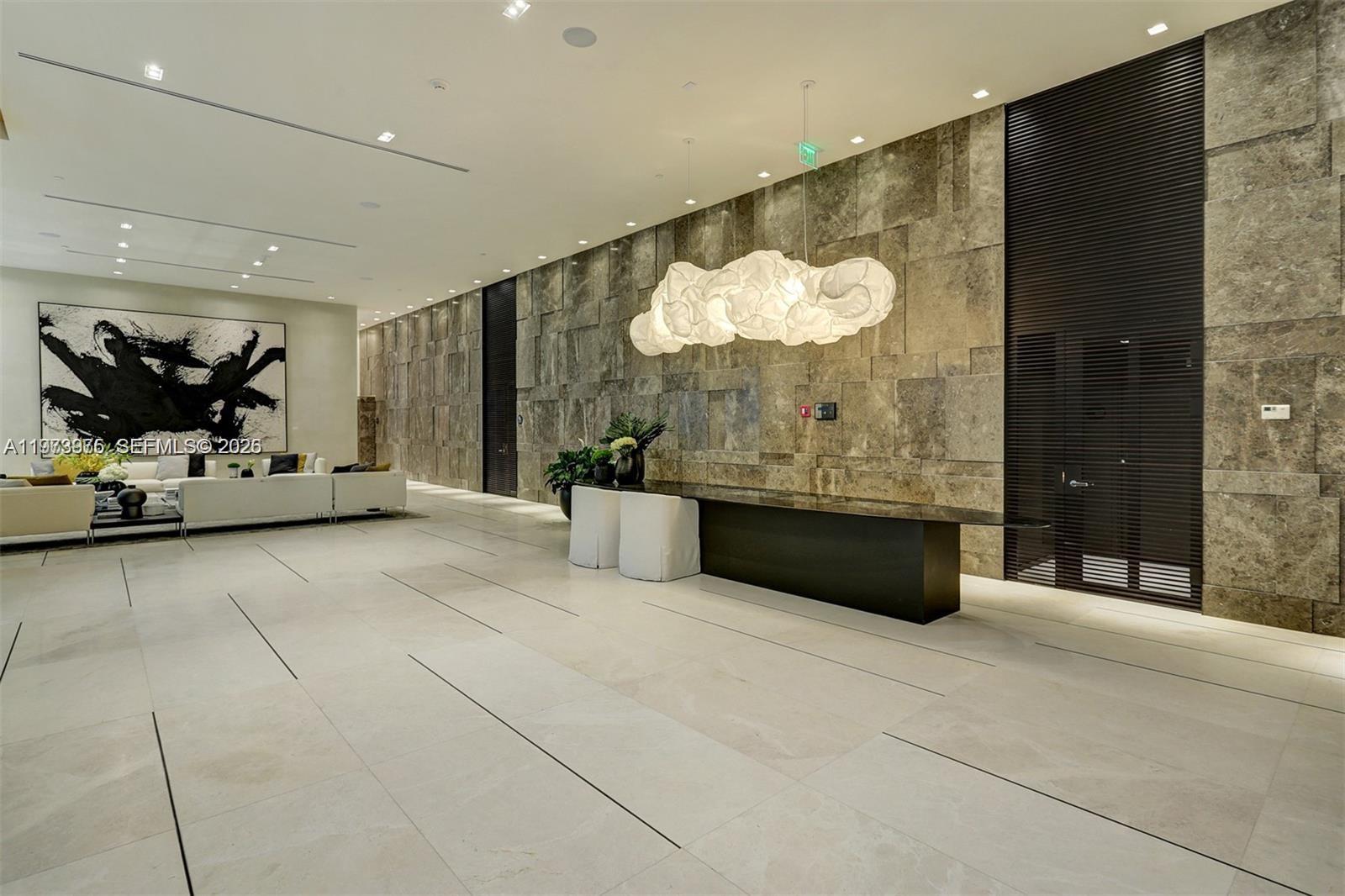 650 Northeast 32nd Street, Unit 2007 Miami, FL 33137 - Photo 37 of 44 a bathroom with a double vanity sink and a mirror