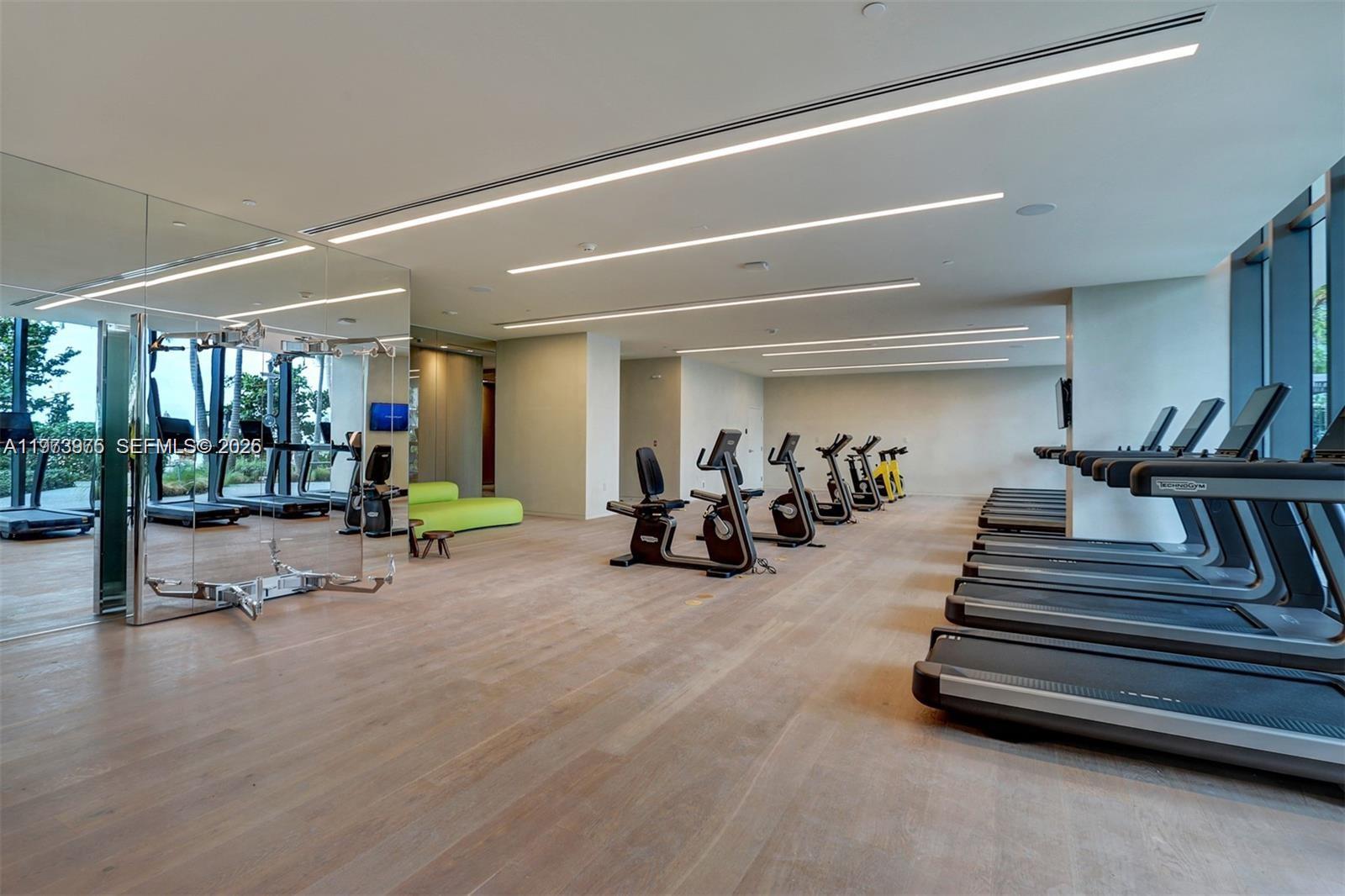 650 Northeast 32nd Street, Unit 2007 Miami, FL 33137 - Photo 38 of 44 a view of a room with gym equipment