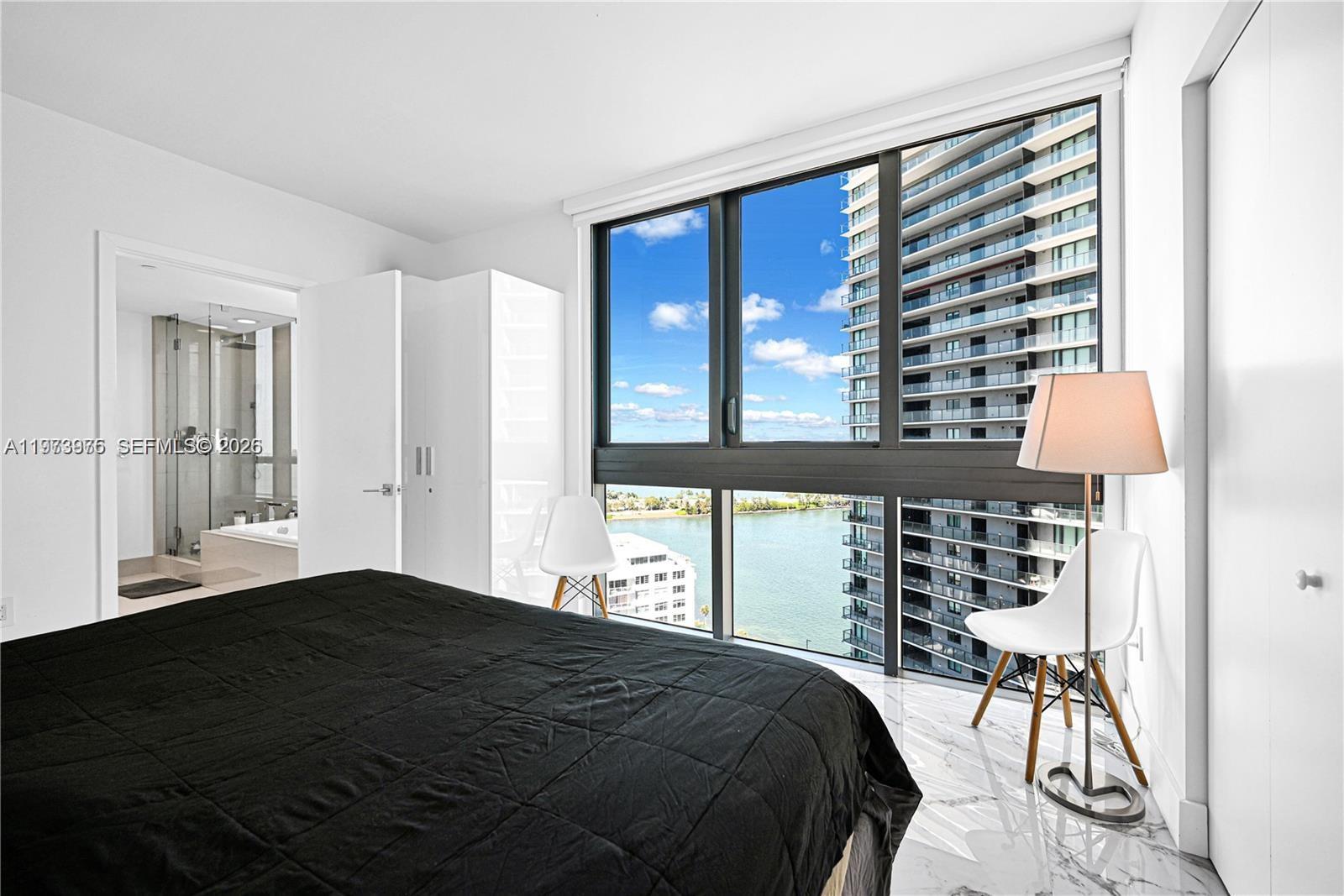 650 Northeast 32nd Street, Unit 2007 Miami, FL 33137 - Photo 10 of 44 a bedroom with a bed and a window