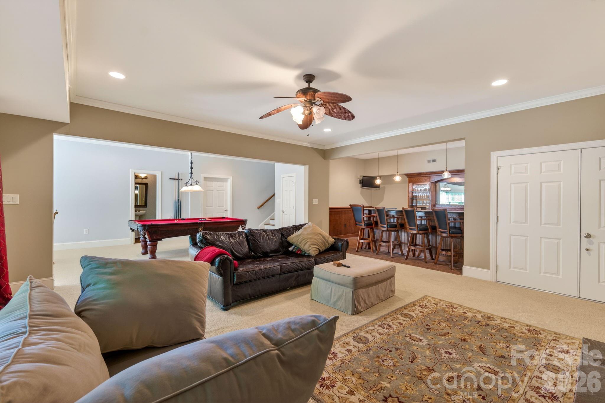 3138 Rappahannock Court, Unit 16 Matthews, NC 28104 - Photo 32 of 38 a living room with furniture and a rug