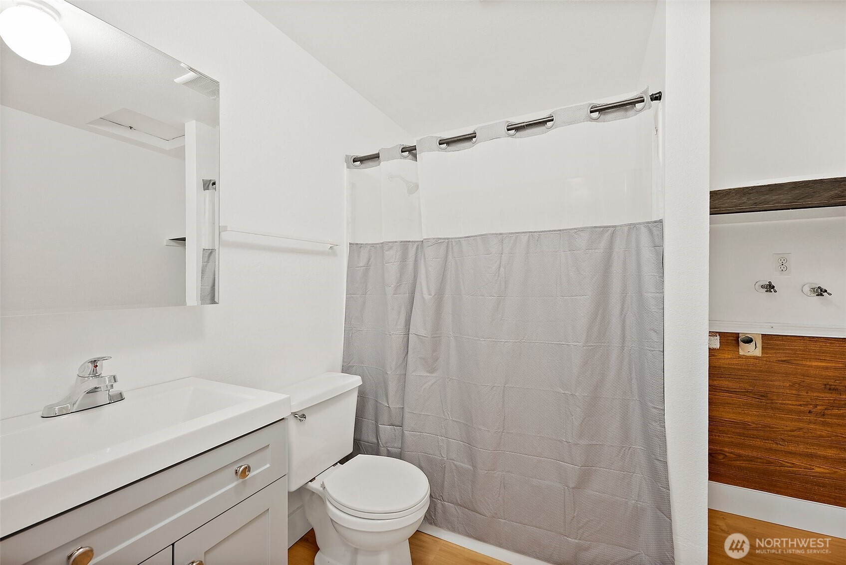 6610 South Madison Street Tacoma, WA 98409 - Photo 16 of 26 a bathroom with a sink a toilet and shower