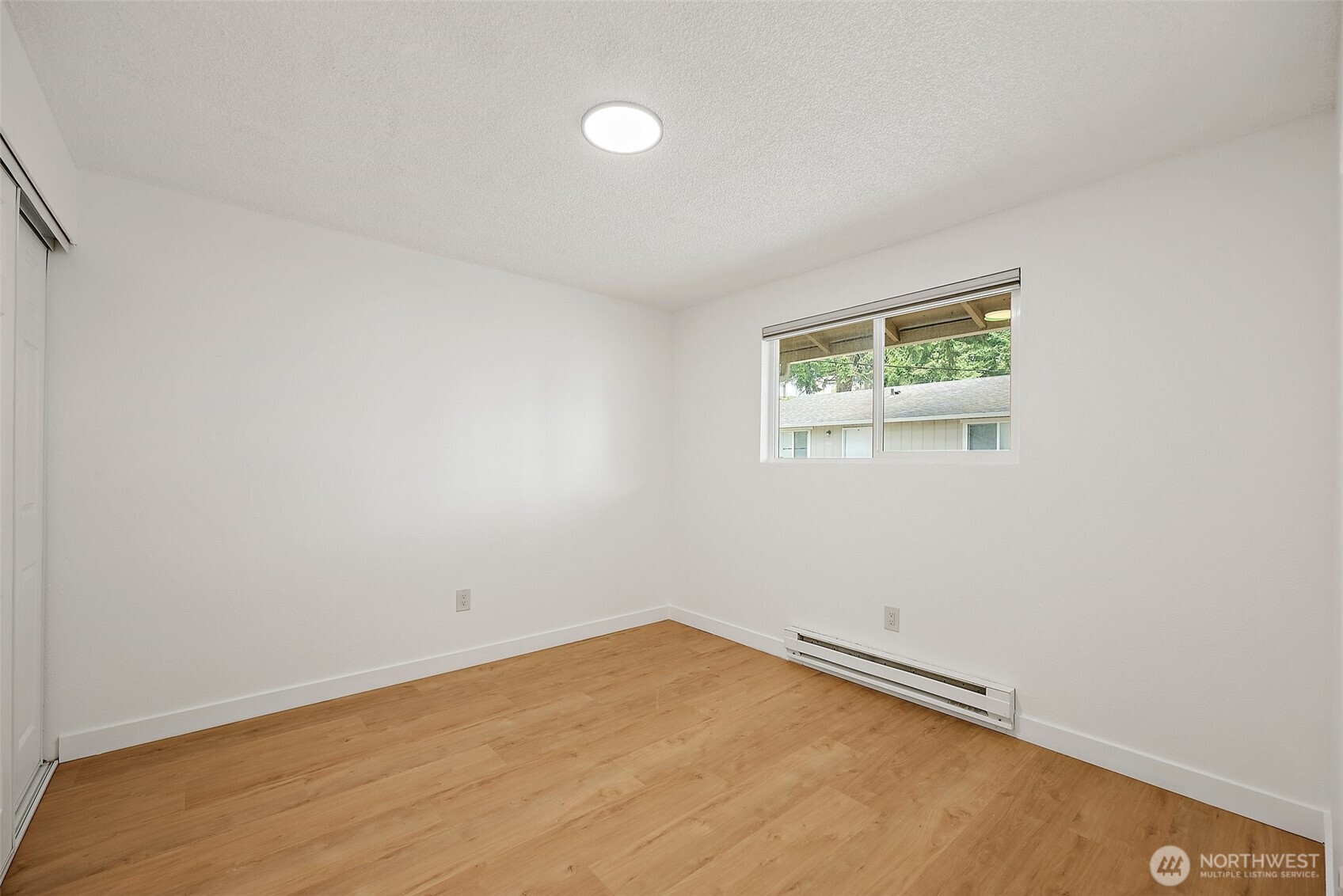 6610 South Madison Street Tacoma, WA 98409 - Photo 17 of 26 an empty room with a window