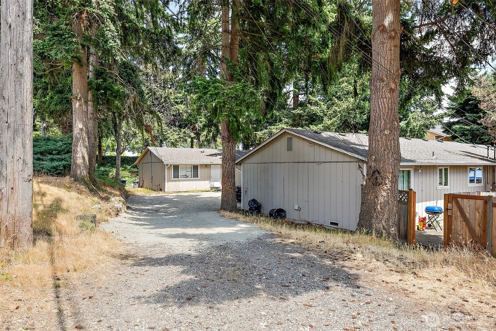 6610 South Madison Street Tacoma, WA 98409 - Photo 20 of 26 a view of a house with a yard and large tree