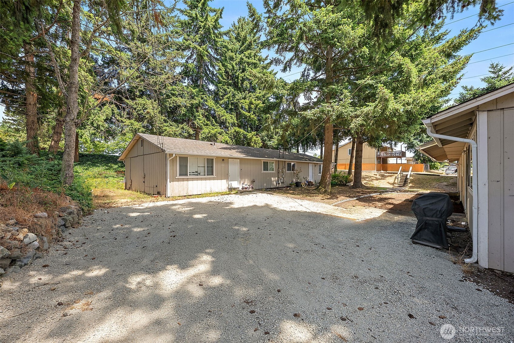 6610 South Madison Street Tacoma, WA 98409 - Photo 21 of 26 a view of a house with a backyard