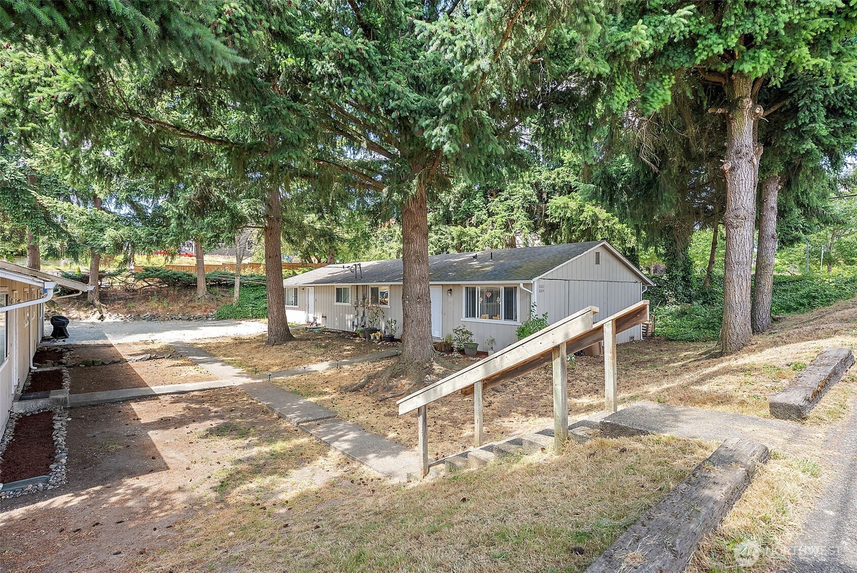 6610 South Madison Street Tacoma, WA 98409 - Photo 23 of 26 a view of a house with a yard