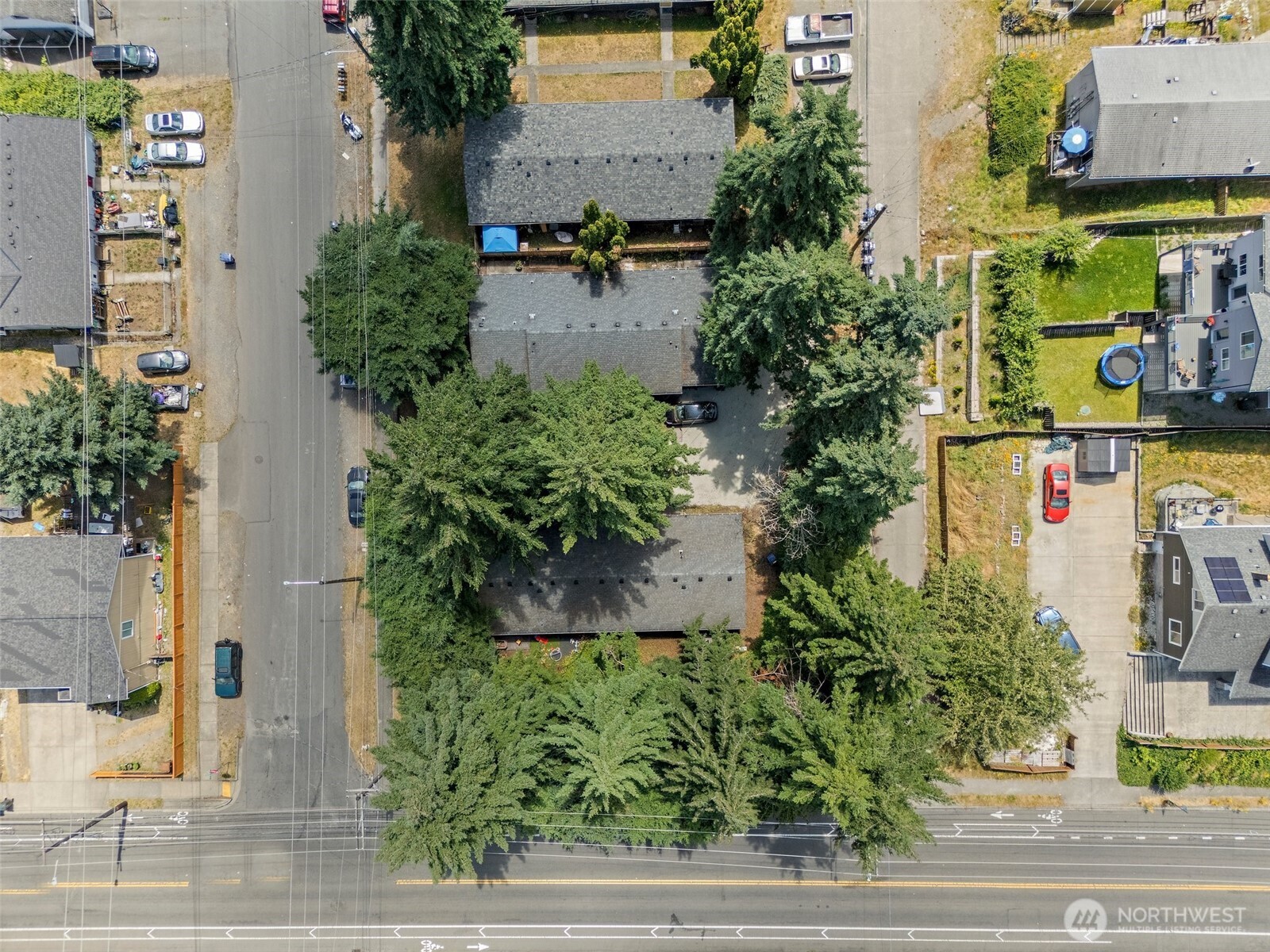 6610 South Madison Street Tacoma, WA 98409 - Photo 24 of 26 an aerial view of houses with yard