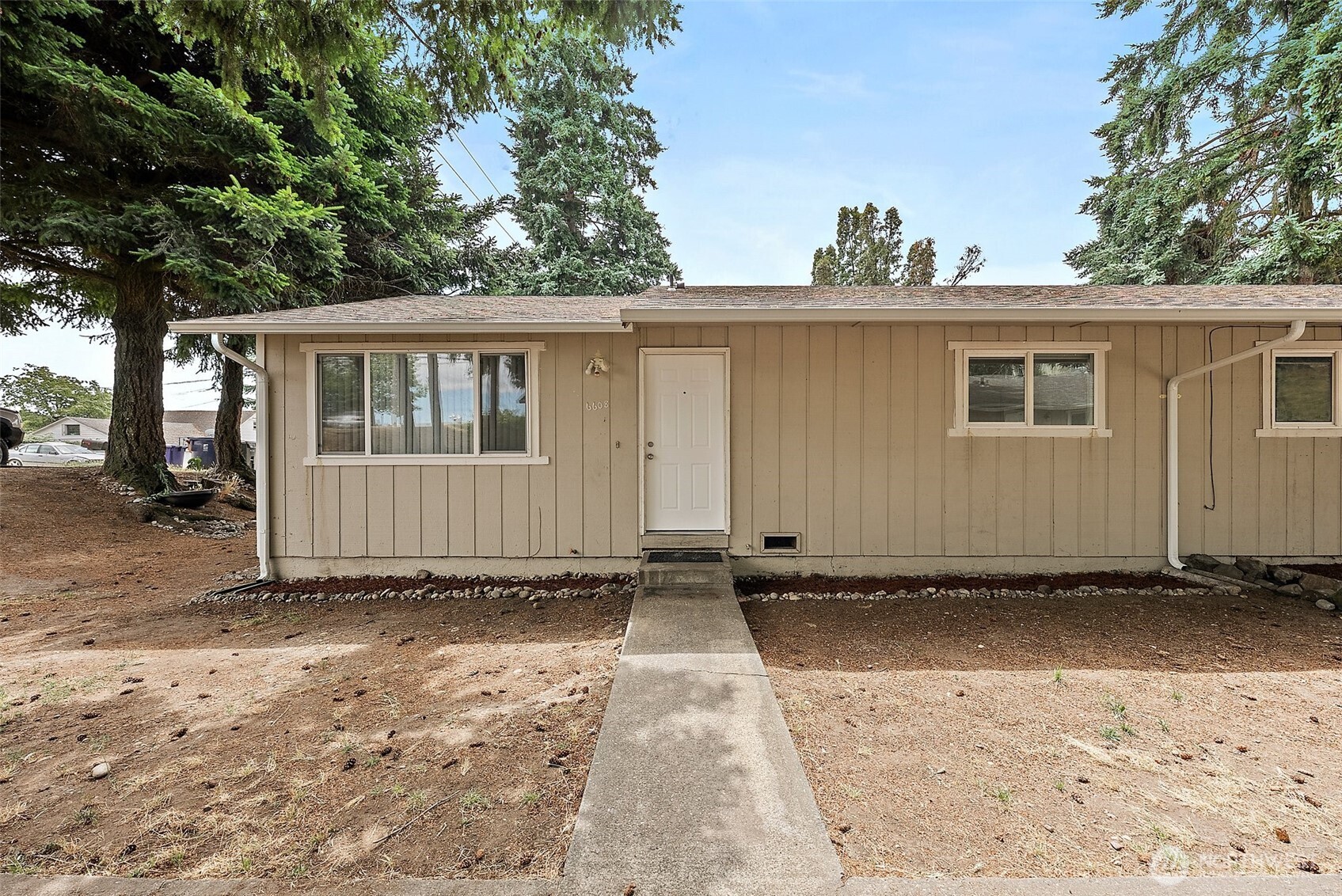 6610 South Madison Street Tacoma, WA 98409 - Photo 3 of 26 a view of a house with a yard