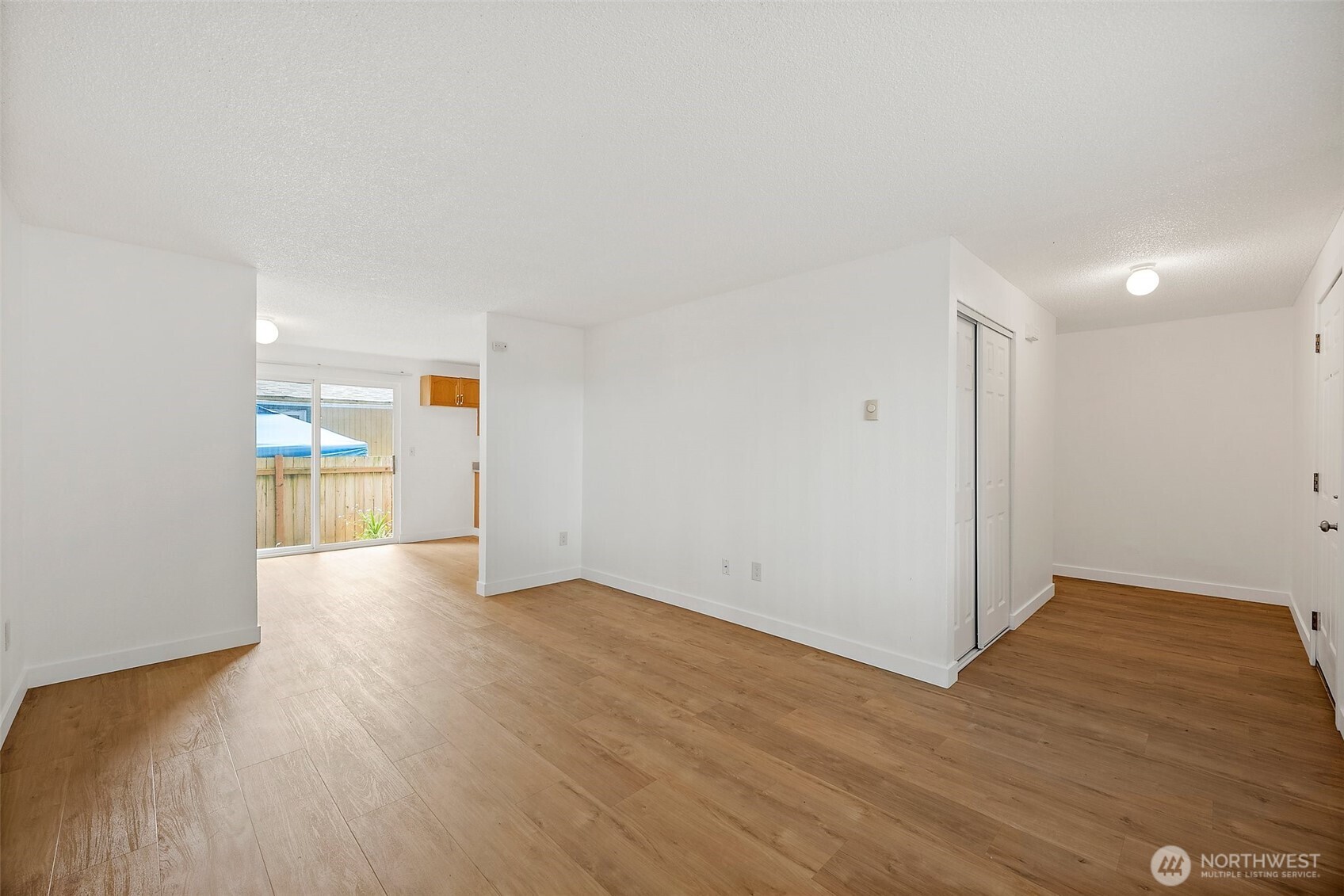 6610 South Madison Street Tacoma, WA 98409 - Photo 6 of 26 a view of empty room with wooden floor