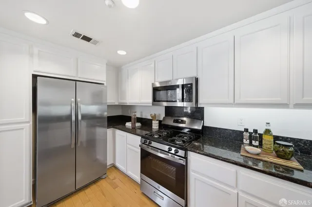 a view of staircase with white walls and windows