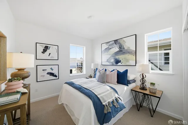 a bedroom with double bed and a window