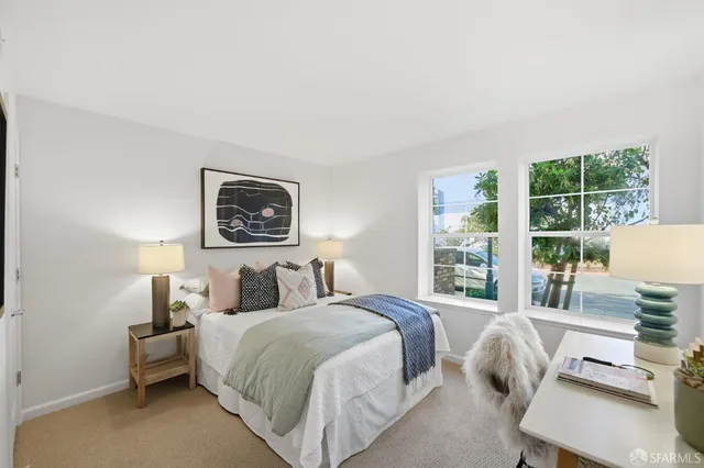 a house that has a tree in front of the house