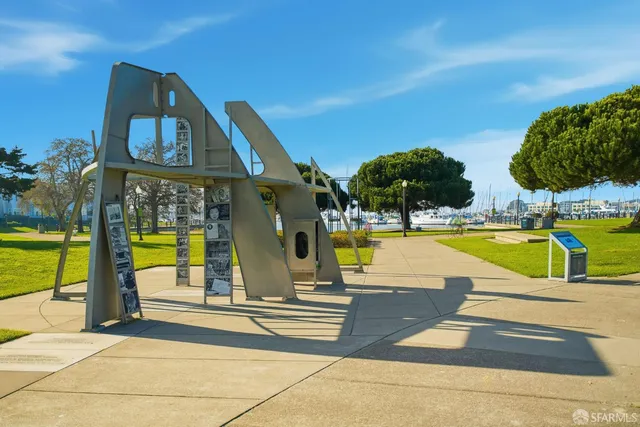 an aerial view of a house with a yard and balcony