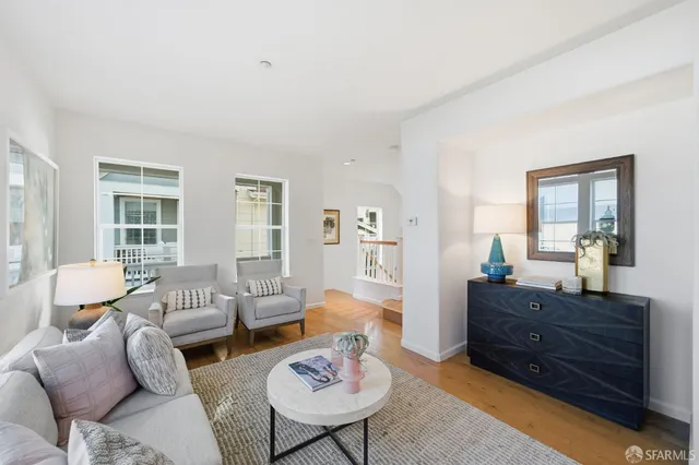 a view of balcony with wooden floor and seating space
