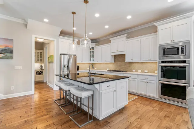 a front view of a house with a yard table and chairs