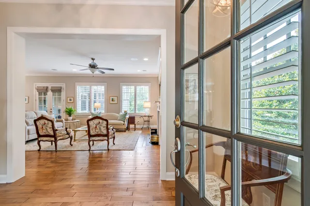 a kitchen with granite countertop a sink a stove and cabinets