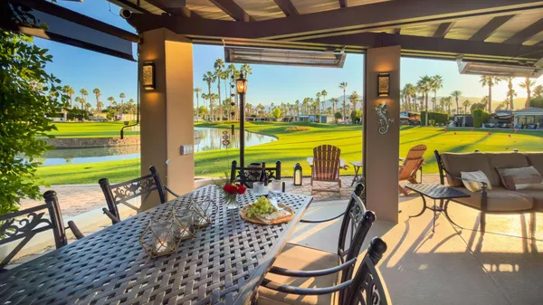 a view of swimming pool with outdoor seating