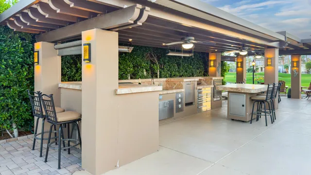 a kitchen with stove and chairs