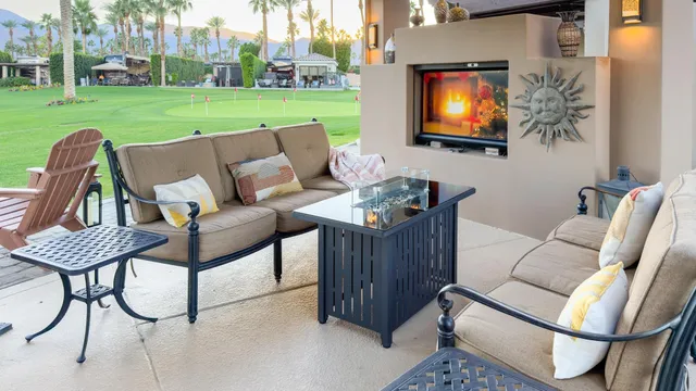 a view of a living room with furniture and a flat screen tv
