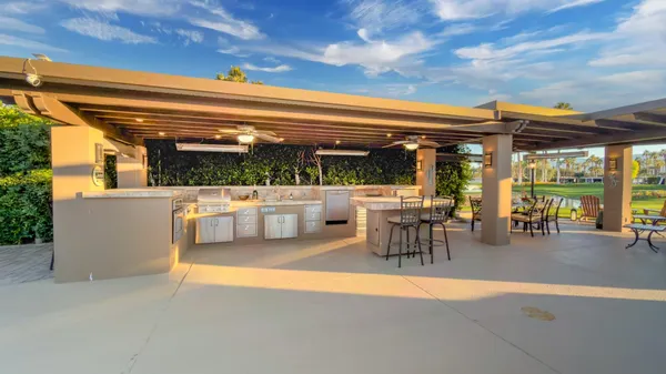 a living room with a table and chairs