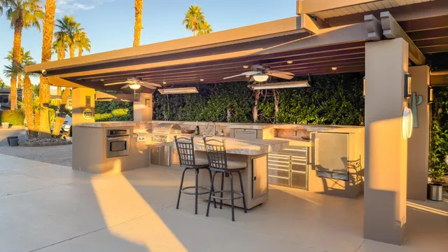 a view of a patio with a table and chairs