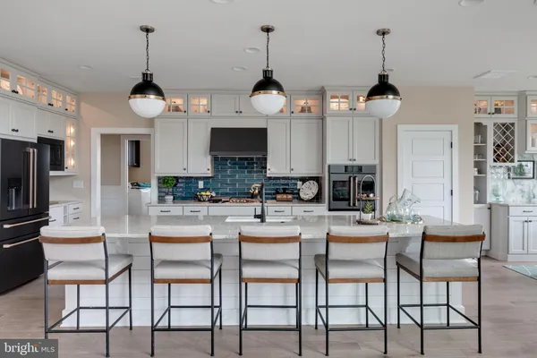 a dining room with furniture and chandelier