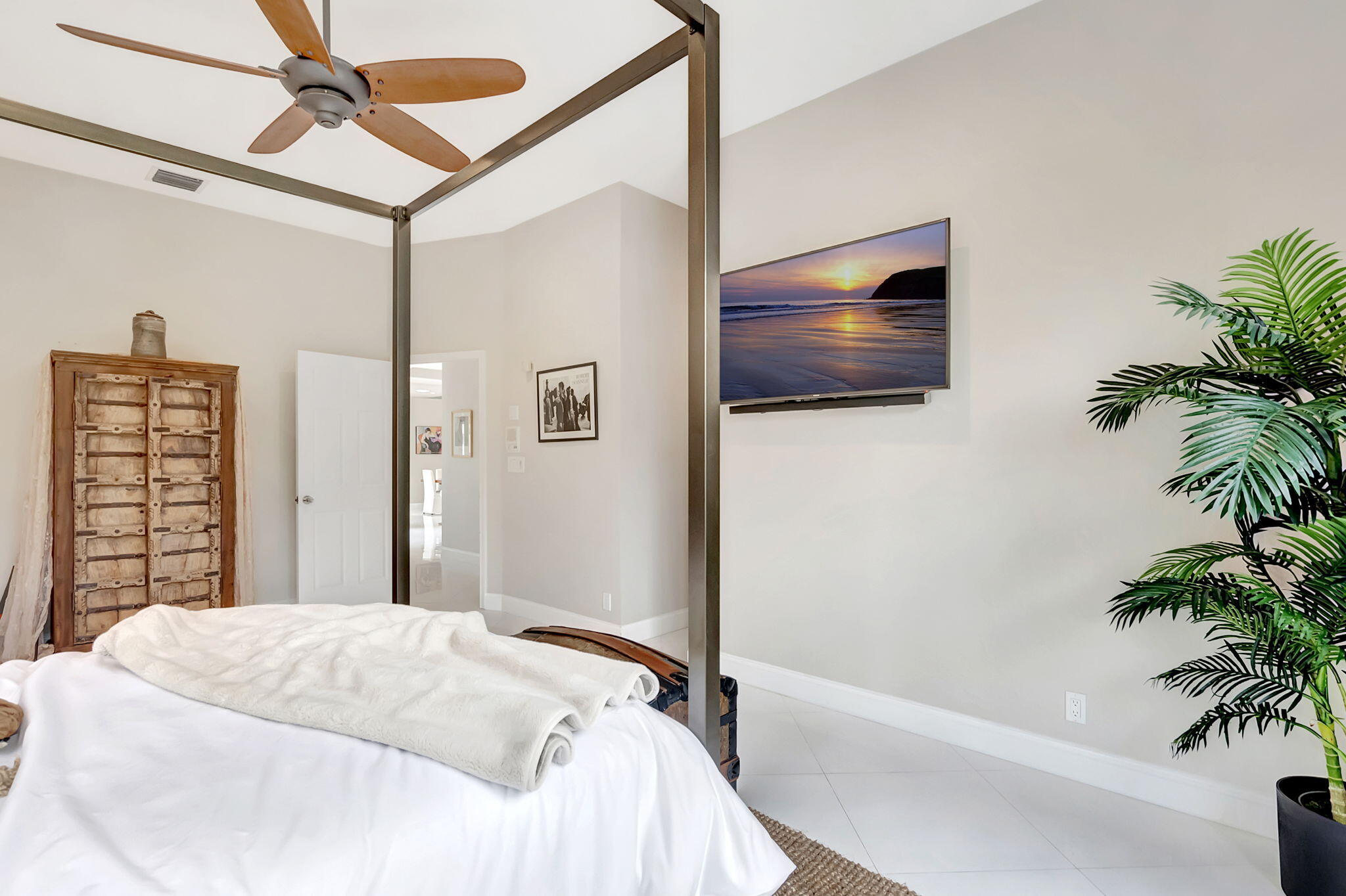 23164 Via Stel Boca Raton, FL 33433 - Photo 19 of 35 a bedroom with a bed and a potted plant