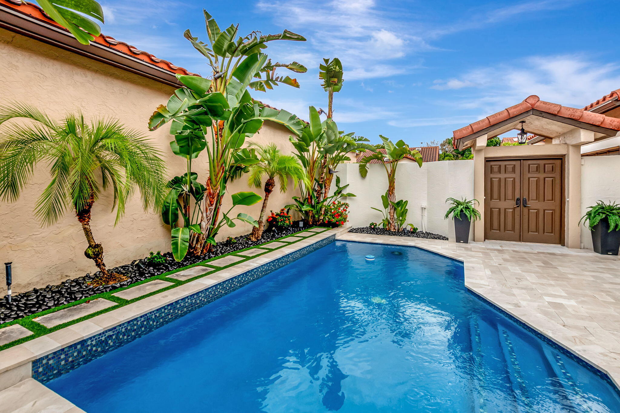 23164 Via Stel Boca Raton, FL 33433 - Photo 29 of 35 a view of a house with a swimming pool