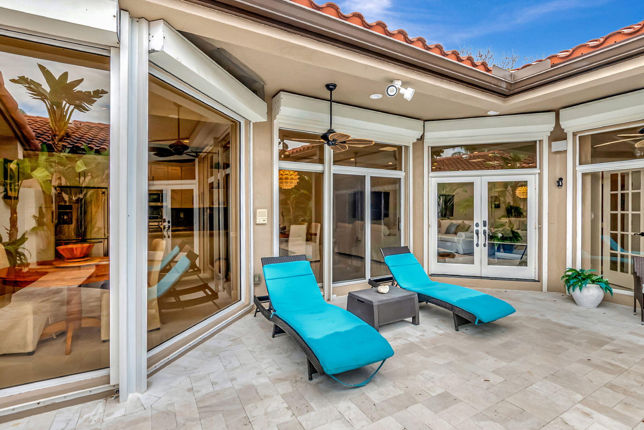 23164 Via Stel Boca Raton, FL 33433 - Photo 33 of 35 a view of a porch with furniture and floor to ceiling window
