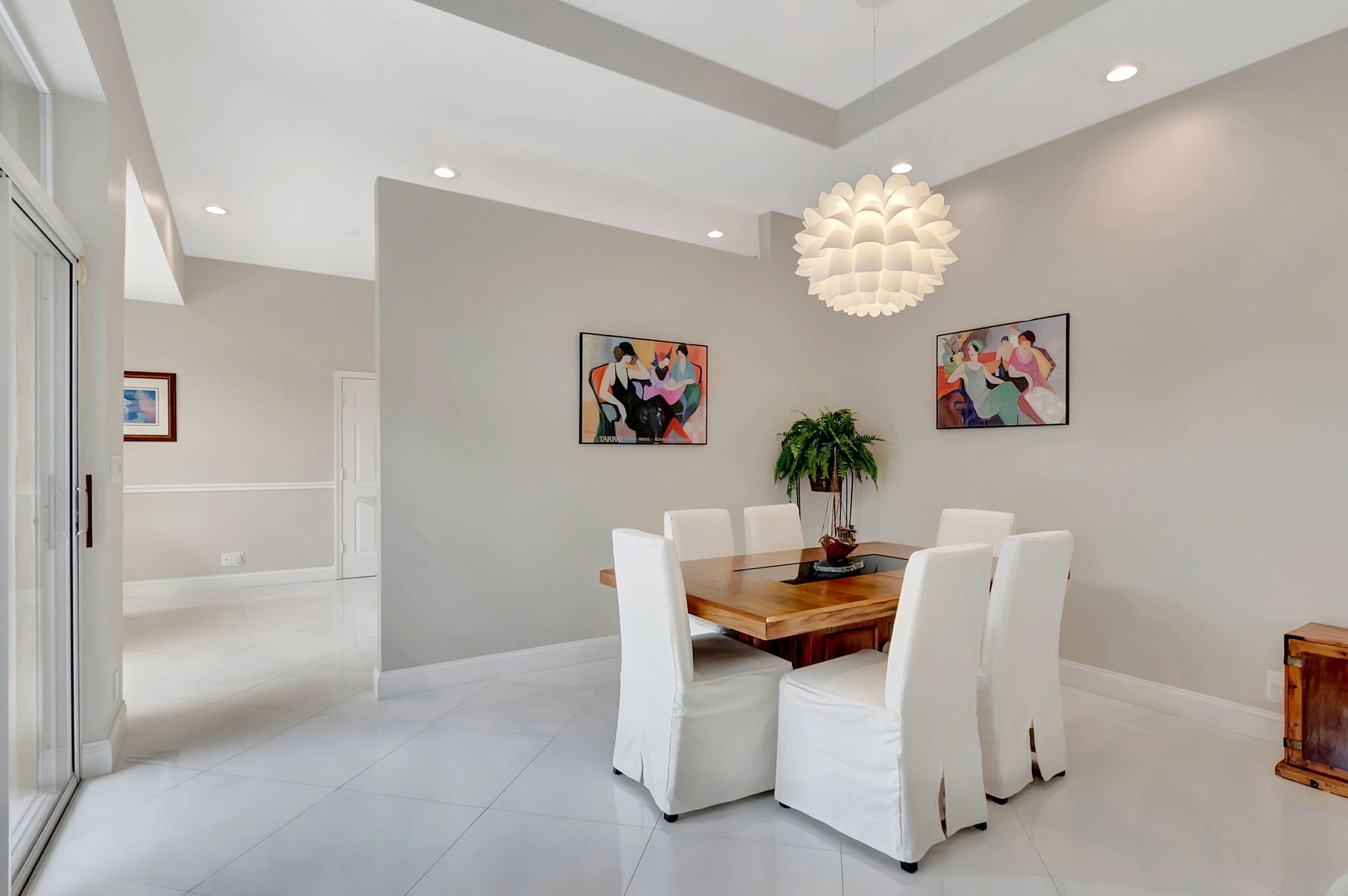 23164 Via Stel Boca Raton, FL 33433 - Photo 9 of 35 a dining room with furniture and a chandelier