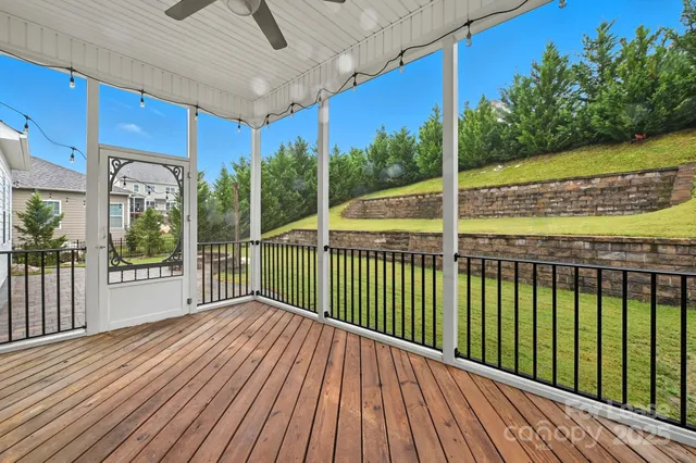 a view of a balcony with wooden floor