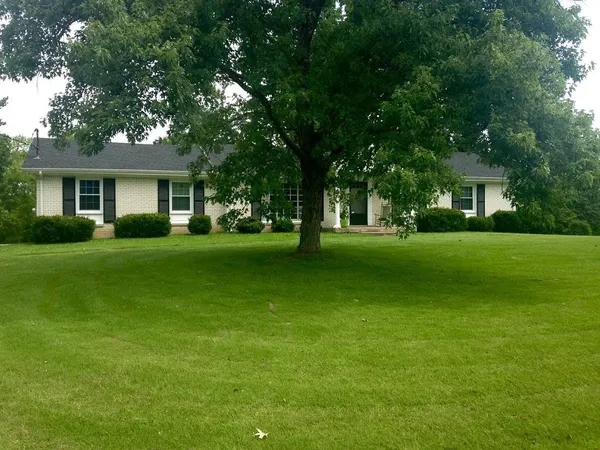 a view of a house with a big yard
