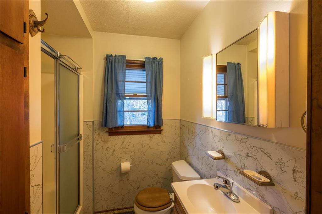 6822 Wallis Road Lithia Springs, GA 30122 - Photo 23 of 24 a bathroom with a sink toilet and shower