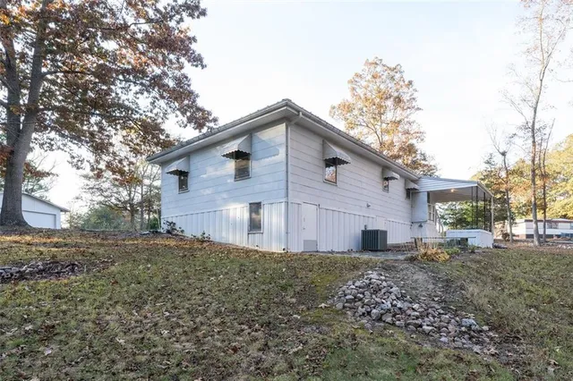 a backyard of a house with large trees