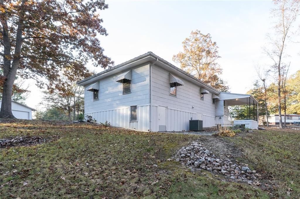 6822 Wallis Road Lithia Springs, GA 30122 - Photo 6 of 24 a backyard of a house with large trees