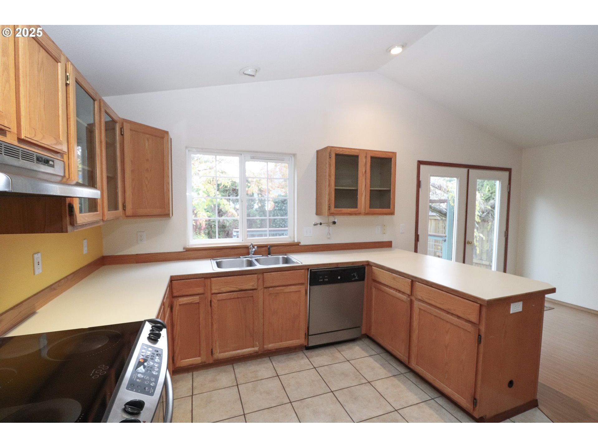 858 South 46th Street Springfield, OR 97478 - Photo 12 of 33 a kitchen with stainless steel appliances granite countertop a sink counter space cabinets and a large window