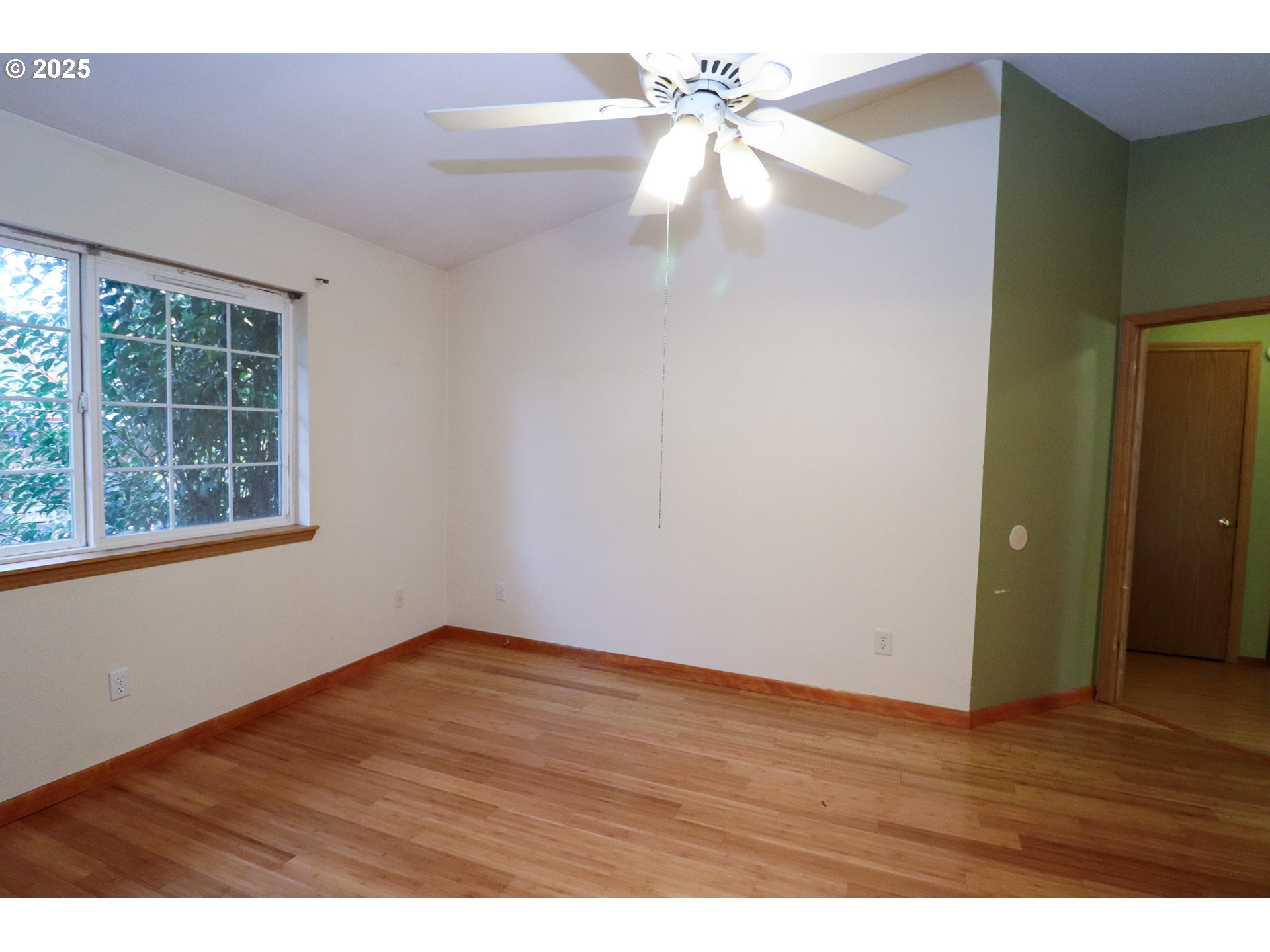 858 South 46th Street Springfield, OR 97478 - Photo 16 of 33 a view of an empty room with wooden floor and a window