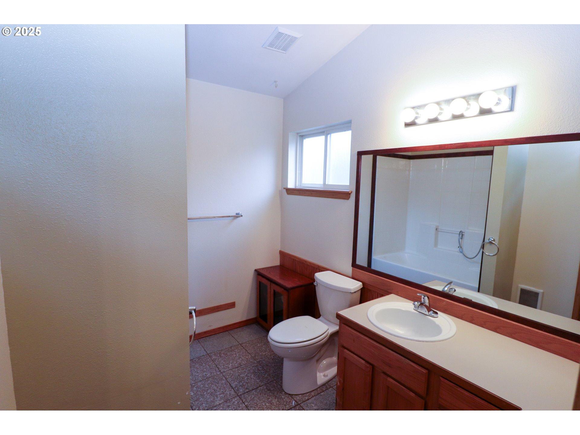 858 South 46th Street Springfield, OR 97478 - Photo 18 of 33 a bathroom with a toilet a sink and mirror