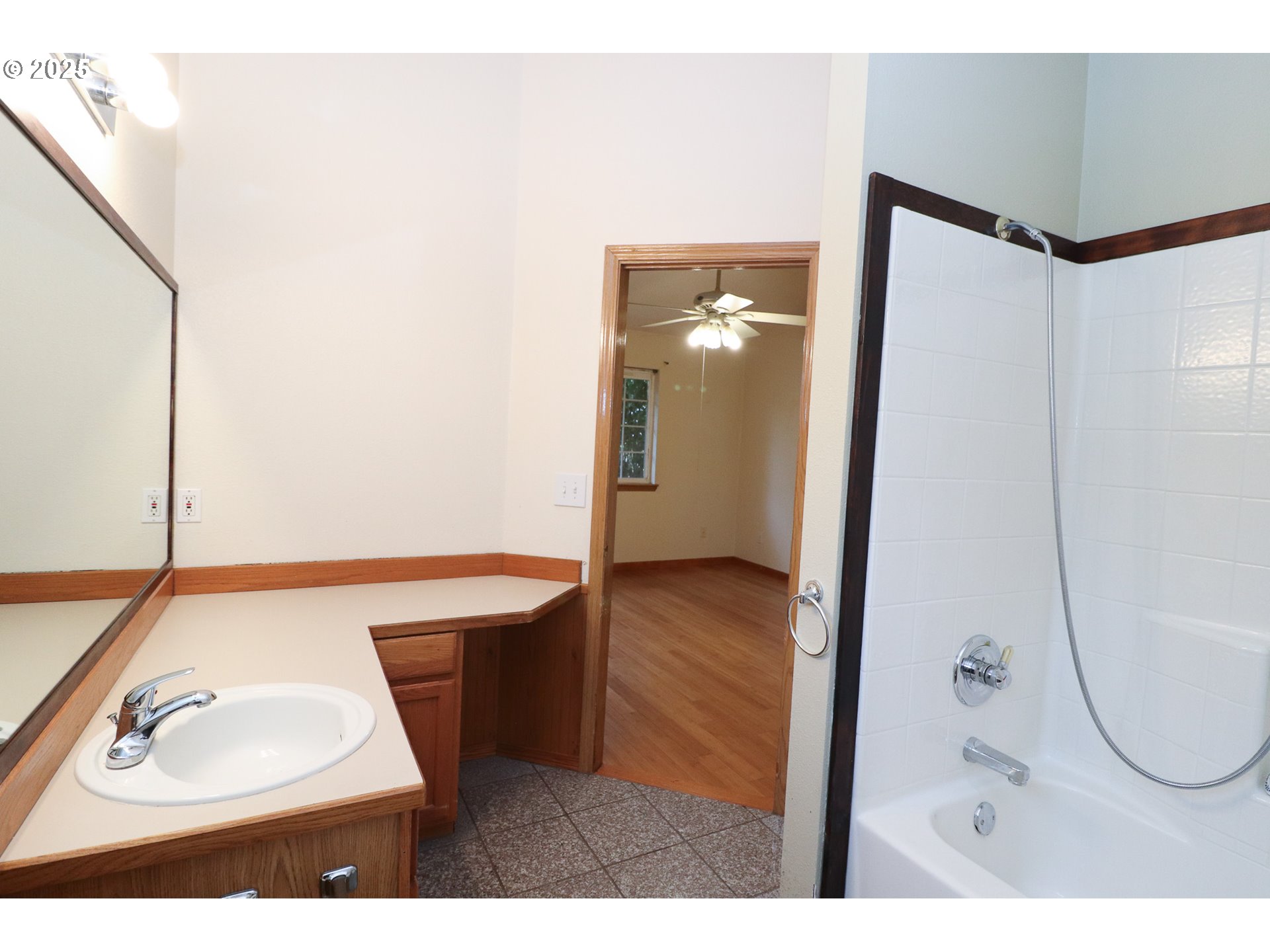 858 South 46th Street Springfield, OR 97478 - Photo 19 of 33 a bathroom with a sink a mirror and a shower