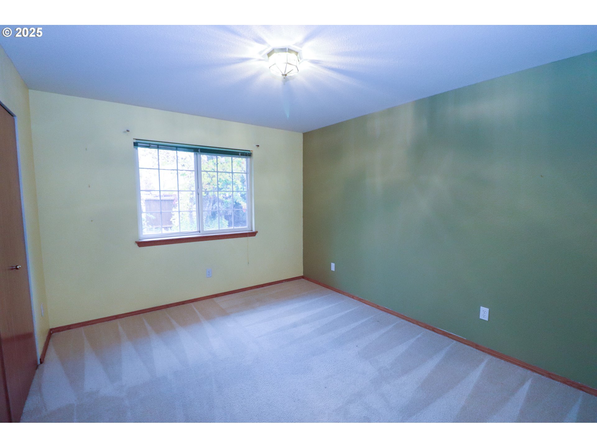 858 South 46th Street Springfield, OR 97478 - Photo 23 of 33 a view of an empty room with window and wooden floor